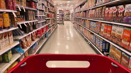 A_Target_grocery_cart_moving_through_the_grocery_aisle