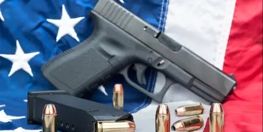 gun control Pistol-On-Flag.jpg[1]